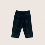 A pair of dress pants in navy and green plaid laid flat on a white background.