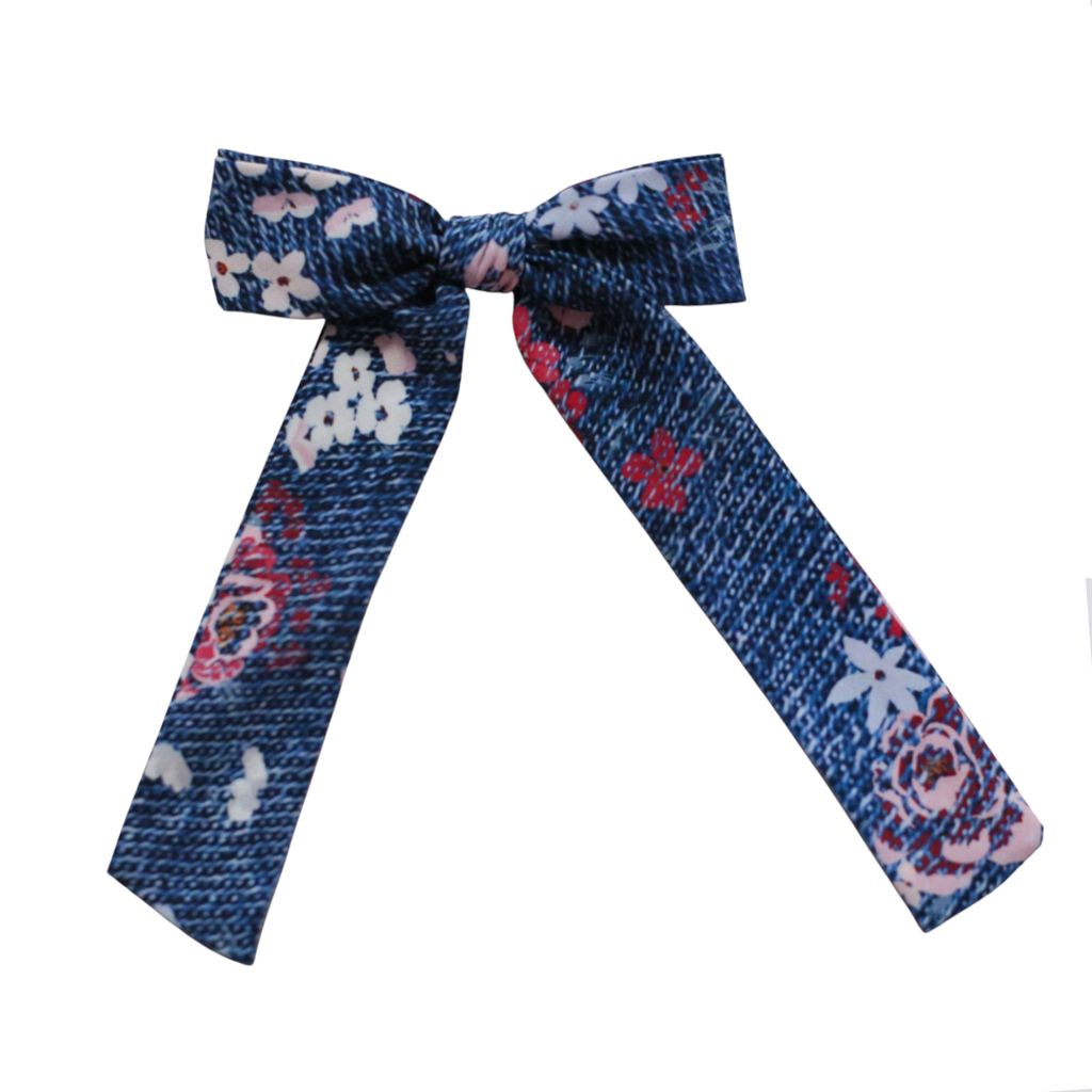 A blue patterned bow tie with a textured weave, featuring white, pink, and red floral motifs, displayed on a solid white background.