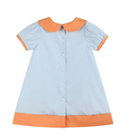 A short-sleeve baby dress in light blue with orange trim on the collar, sleeve cuffs, and bottom hem, featuring a button-up front.