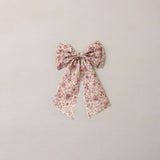 Floral bow on a light gray background