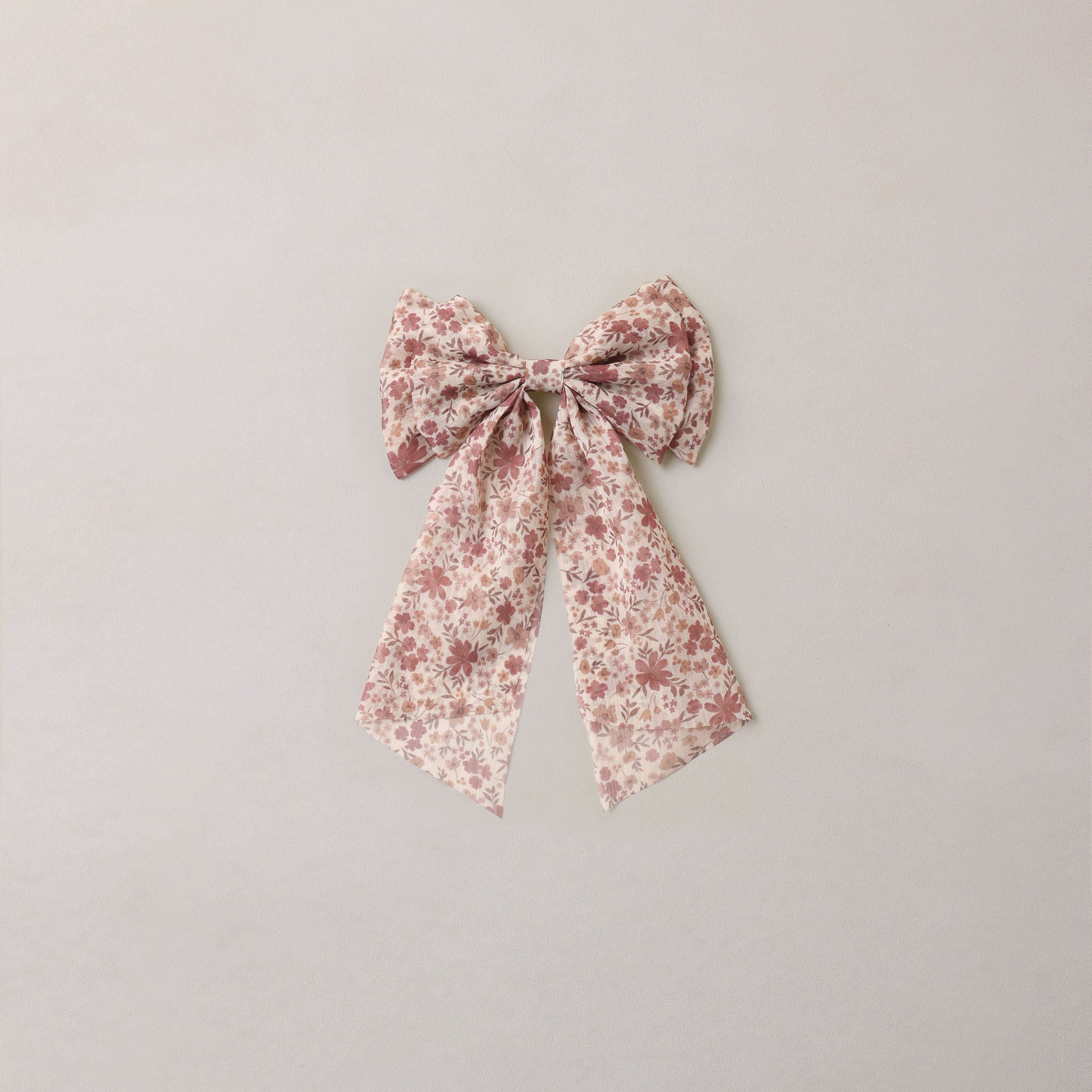 Floral bow on a light gray background