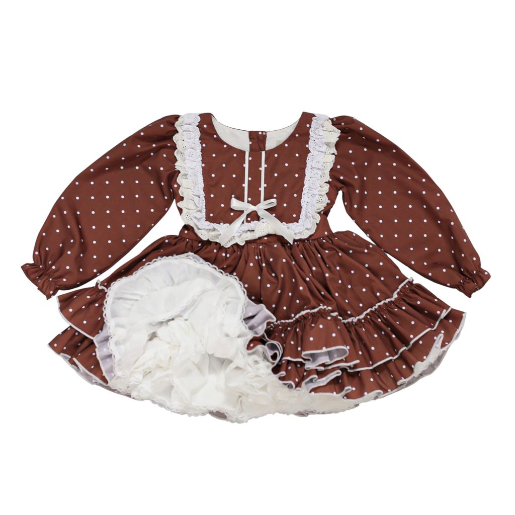 A baby girl's long-sleeve dress in brown with white polka dots, featuring white lace trim & a ruffled collar. 