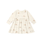 A babydoll dress featuring a minimalist all-over print of turkeys and wildflowers. 