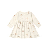 A babydoll dress featuring a minimalist all-over print of turkeys and wildflowers. 
