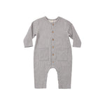 Navy and white checkered baby romper on a white background
