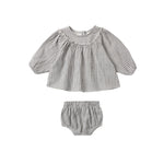 Baby outfit with checkered top and bloomers on a white background