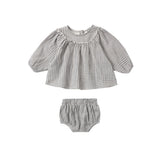 Baby outfit with checkered top and bloomers on a white background