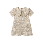 A short-sleeve babydoll dress with a beige and brown leopard print pattern, featuring a ruffled collar and ruffle trim along the neckline.