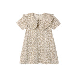 A short-sleeve babydoll dress with a beige and brown leopard print pattern, featuring a ruffled collar and ruffle trim along the neckline.