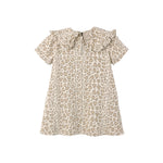 A short-sleeve babydoll top with a beige and brown leopard print pattern, featuring a large ruffled collar and tie detail at the neckline, shown against a plain white background.
