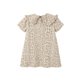 A short-sleeve babydoll top with a beige and brown leopard print pattern, featuring a large ruffled collar and tie detail at the neckline, shown against a plain white background.