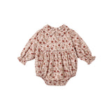 A baby long-sleeve romper in a beige and brown floral print with red accents, featuring a Peter Pan collar, smocked chest, and elastic leg cuffs, shown flat on a white background.