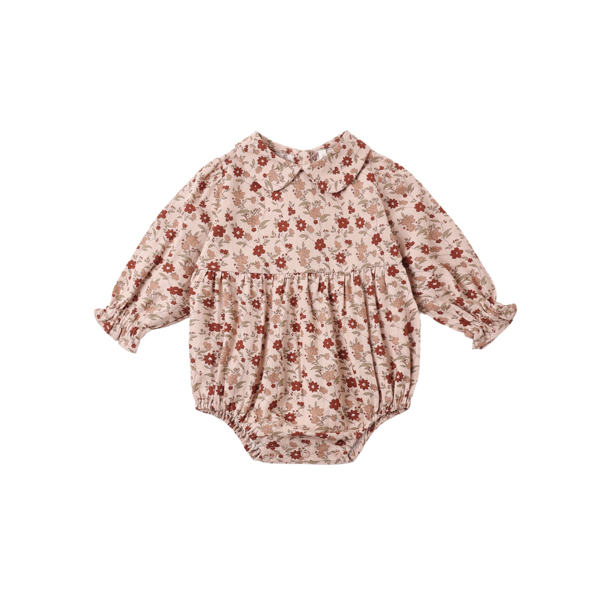 A baby long-sleeve romper in a beige and brown floral print with red accents, featuring a Peter Pan collar, smocked chest, and elastic leg cuffs, shown flat on a white background.
