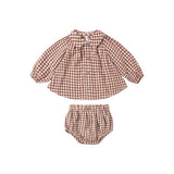 A two-piece baby outfit set featuring a long-sleeve button-up shirt and matching bloomers in a brown and white gingham check pattern, displayed flat on a white background.