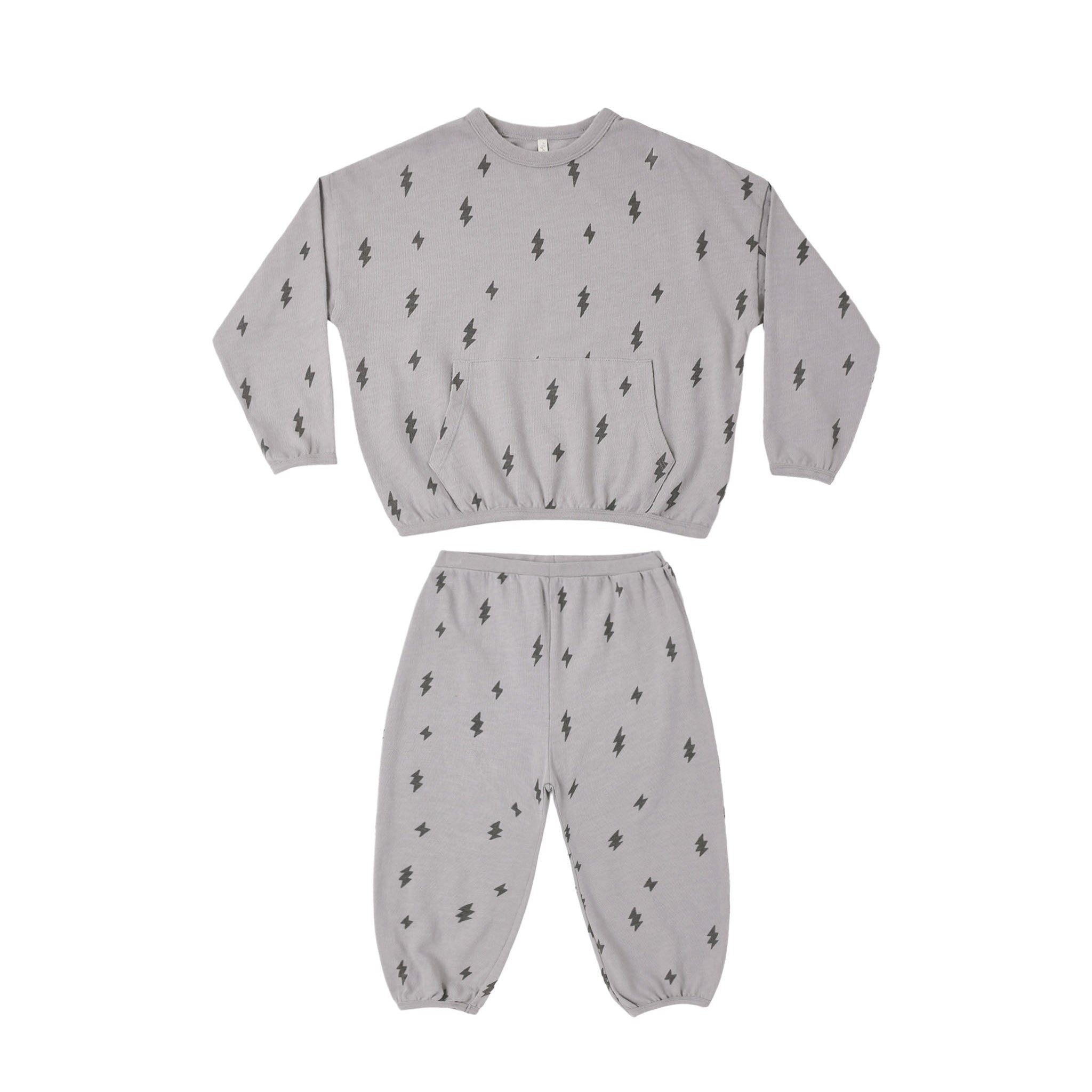 A two-piece children's loungewear set in light gray, featuring a long-sleeve top and matching pants, both printed with a small black tree motif.