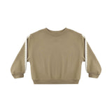 A cropped long-sleeve sweatshirt in a warm khaki-beige color, featuring textured cream lace or crochet trim running down both sleeves, shown flat on a white background.