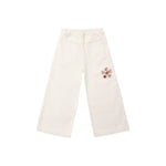 Off-white wide-leg pants with an elastic waistband, back pockets, and a small embroidered floral detail on the left leg, shown against a plain white background.