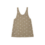 A sleeveless brown vest with a white daisy pattern, featuring a button-up front and two front patch pockets, shown flat on a white background.