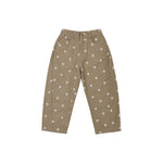 A pair of high-waisted, wide-leg cropped pants in a warm khaki-beige color, decorated with a small white daisy pattern throughout. The pants are shown flat against a solid white background.