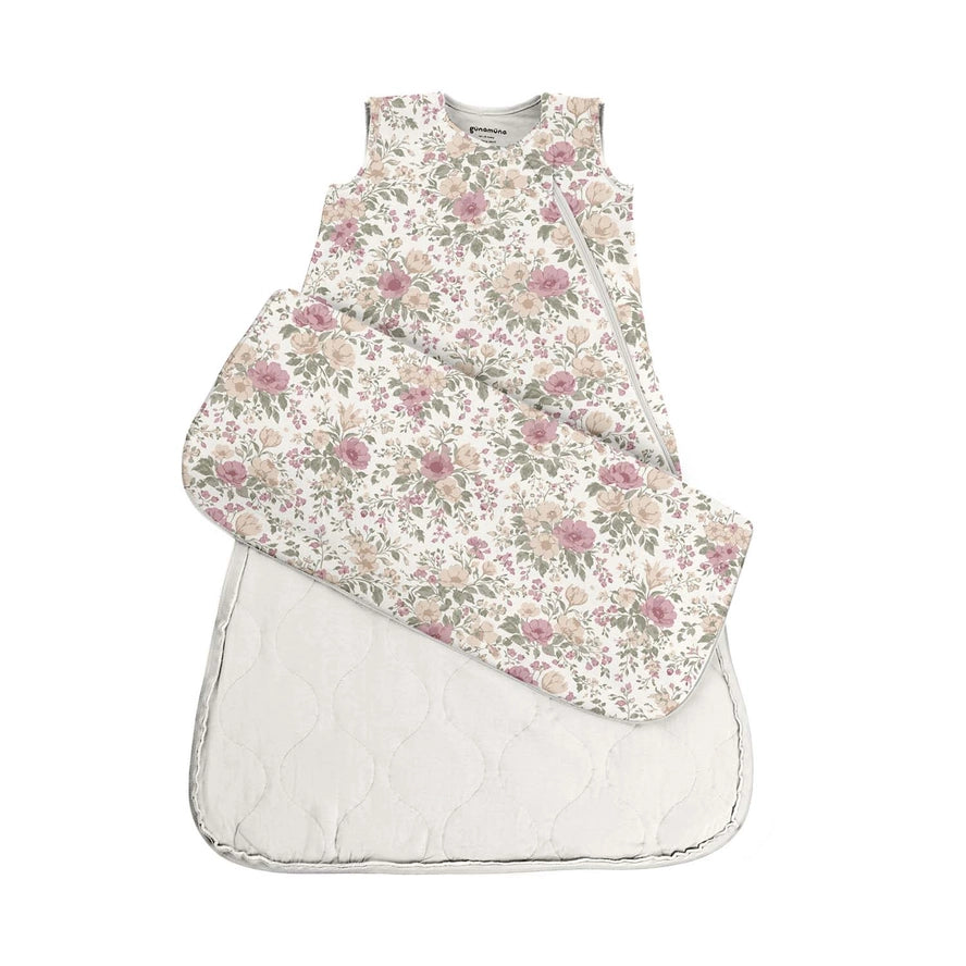 Floral-patterned baby sleeping bag on a white background