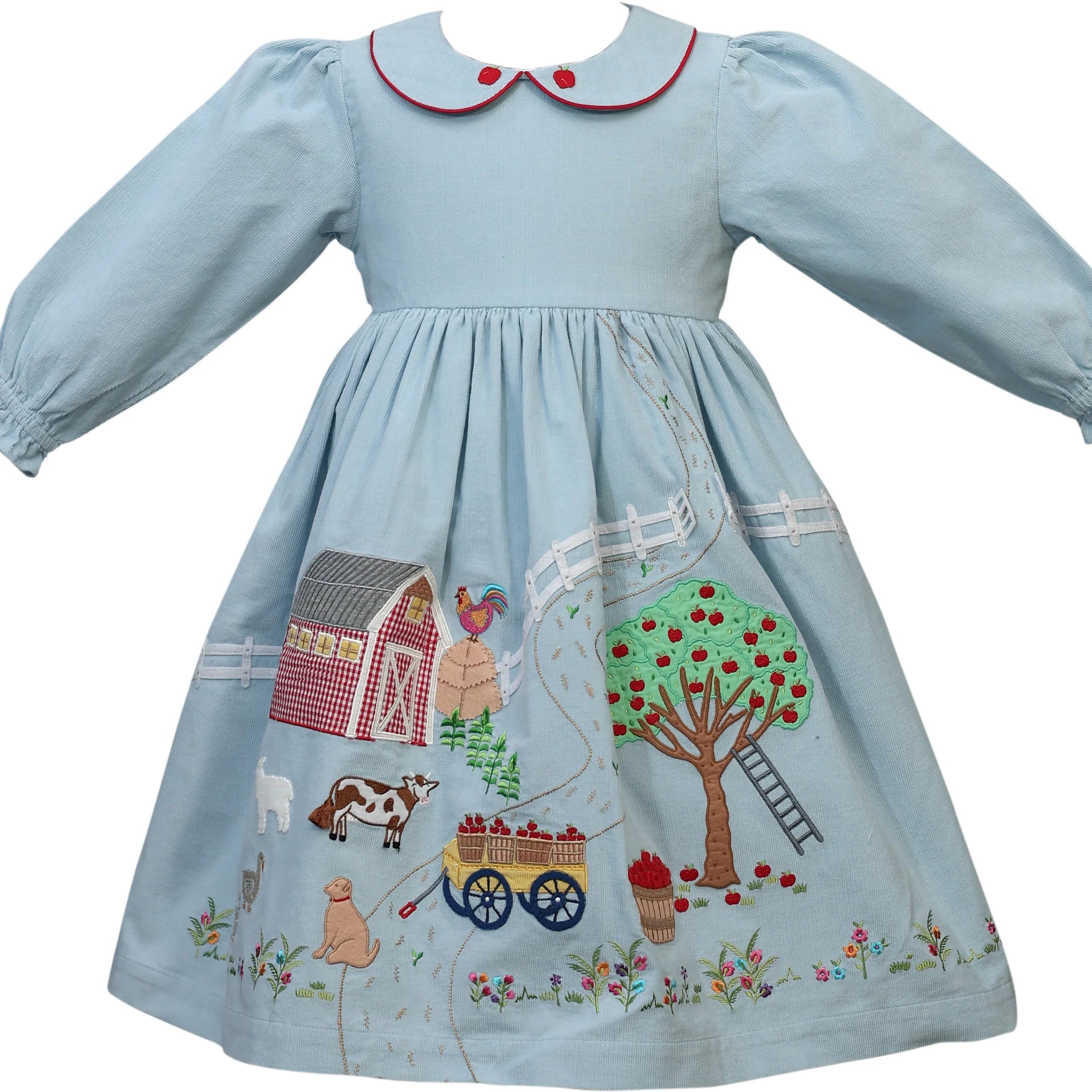 A light blue baby girl's dress with long puff sleeves, a Peter Pan collar trimmed in red, and a whimsical embroidered farm scene on the skirt featuring a barn, apple tree, cow, chicken, and wagon.