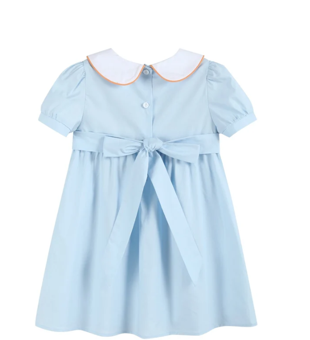 A light blue short-sleeve girl's dress with a white Peter Pan collar outlined in orange, featuring a button front, a matching waist tie bow, and a flared skirt.