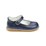 Navy blue shoe with a gum sole on a white background