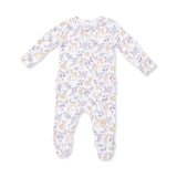 A baby footed sleeper with long sleeves and legs, featuring an all-over print of light brown deer and purple flowers on a white background.