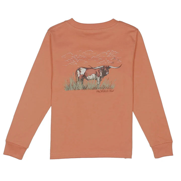 Coral long-sleeve shirt with a cow graphic on a white background