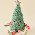 A plush Christmas tree toy with a textured mint green body, red and white striped arms and legs, a small red nose, and a gold star on top, sitting against a solid beige background.