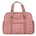 A pink duffel bag with a small white and blue floral pattern, featuring two top handles and a front zippered pocket, shown against a plain white background.