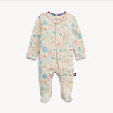 A baby footed sleeper with long sleeves and an all-over whimsical animal print in pastel blue, pink, and orange on a cream background, shown flat on a light gray background.