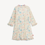 A long-sleeve baby dress with a cream base and an all-over print of cute cartoon animals in pastel blue, pink, and orange. The dress features ruffled cuffs and a ruffled hem, and is shown against a plain light background.