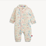 A baby long-sleeve footless romper in cream with a colorful cartoon animal print, featuring a snap-button front and a small red tag on the lower leg.