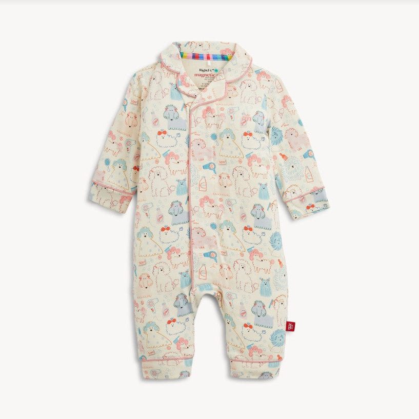 A baby long-sleeve footless romper in cream with a colorful cartoon animal print, featuring a snap-button front and a small red tag on the lower leg.